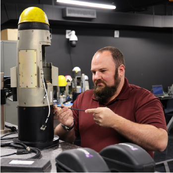 Image of an AvMC engineer working on missile systems